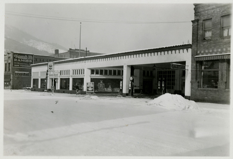 A view of the Yellowstone Trail Garage building. A person can be seen walking in front.