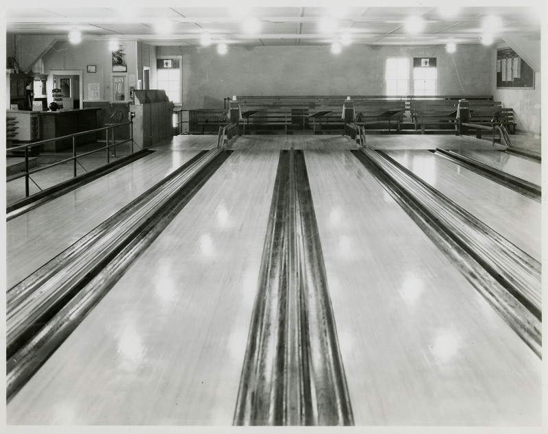 The interior of the Wallace bowling alley facing the beginning of the bowling lanes.