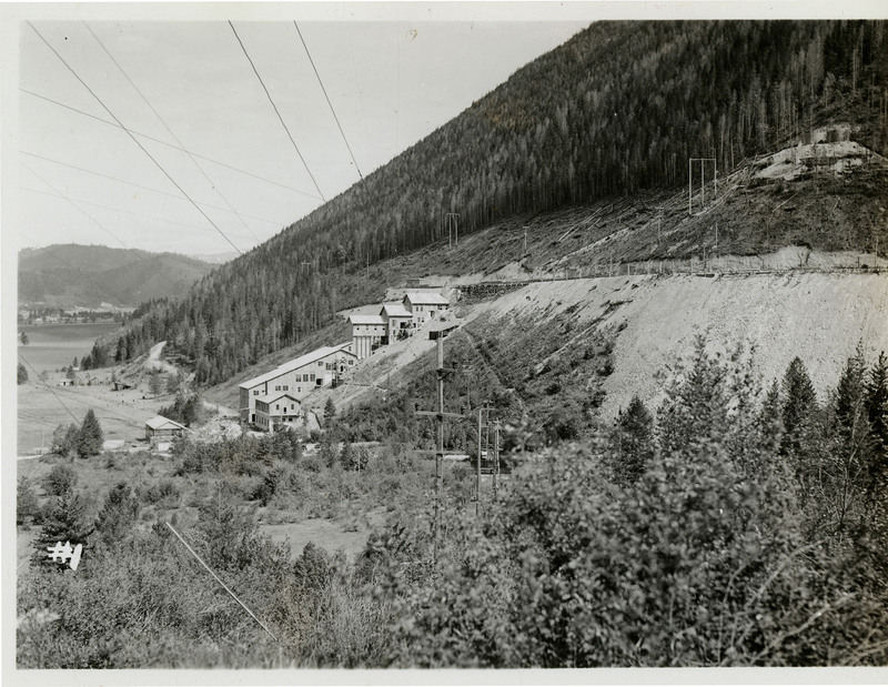 A view of Silver Summit Mine in Shoshone County, Idaho. There are buildings alongside the mountain. 