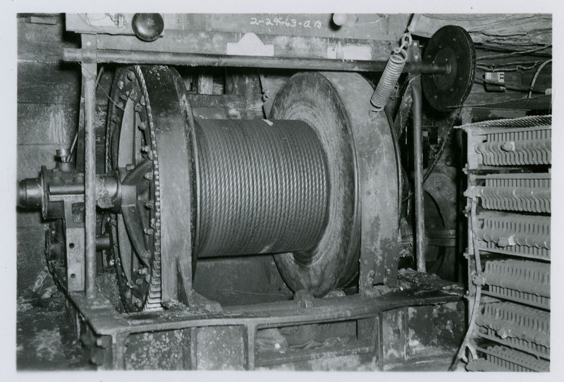 A spool of wire and mining equipment.