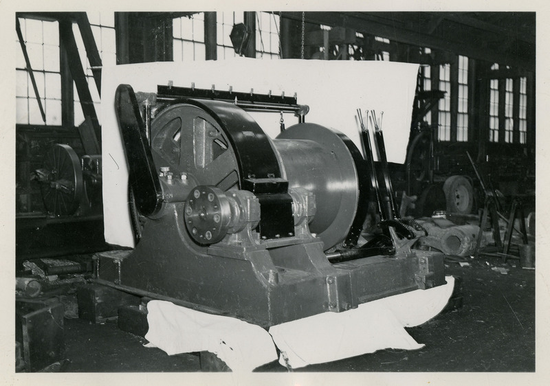 Photograph of mining machinery inside a room.