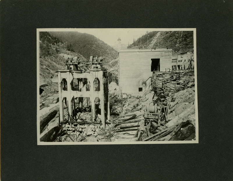 The remnants of the Hecla Mining Company rock house after fire. Some structures remain intact.
