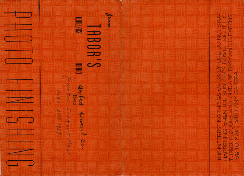 Bright orange photograph envelope, handwritten text on the inside bottom flap reads "E.L. Vowels [illegible]" "Photos taken-May 31st, 1937. Lookout Pass." Handwritten text on outside flap reads "United transit co. Bus, Photos Lookout Pass May-31st 1937."
