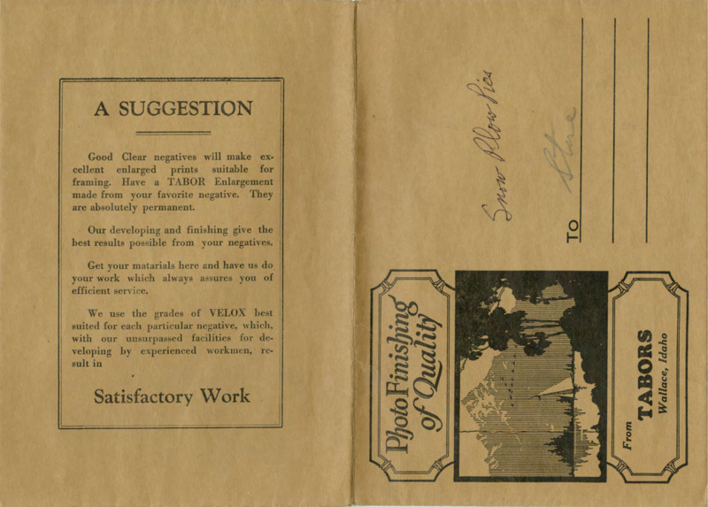 Brown photograph envelope with a small illustration of a landscape. Handwritten text on the outside flap reads "Snow Plow Pics" and "Store." Handwritten text on the inside flap reads "Store."