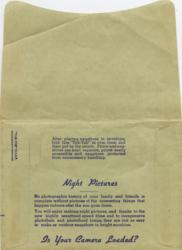 Green photograph envelope with handwritten text that reads "First Air Mail Flight Photos May-19-38" on the outside flap.