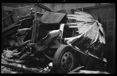 Photo of a totaled hardware truck after it was hit by a Union Pacific Train in Coeur d'Alene, Idaho. It is actively snowing in the photo, and the train that hit the truck is not visible.
