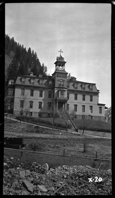 Photo of the Providence Hospital in Wallace, Idaho. The sign near the top of the three story building reads, "Providence Hospital 1891."