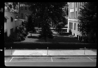 Photo of a small courtyard between two buildings. Previously described as "Courthouse," so possibly a courtyard of a courthouse.
