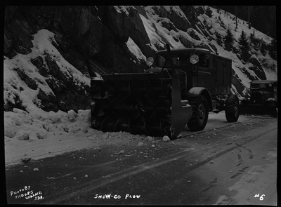 Photo of a snow blower removing snow from the road at Lookout Pass. The snow plower is referred to as Snow-Go Plow.