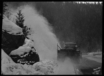 Photo of a snow blower removing snow from the road at Lookout Pass. The snow plower is referred to as Snow-Go Plow.