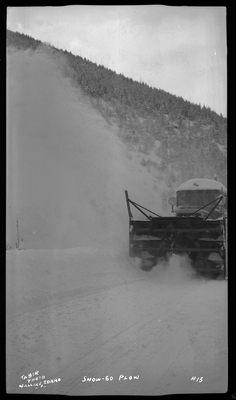 Photo of a snow blower removing snow from the road at Lookout Pass. The snow plower is referred to as Snow-Go Plow.