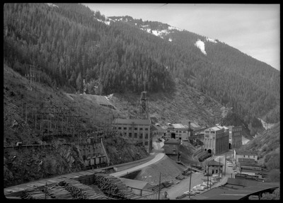Overhead view image of Hecla Mining Company facilities at the Star Mine in Burke, Idaho. Several buildings are visible, many of which are connected to each other, as well as some cars parked throughout the area.