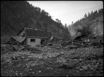 Damaged house and debris after a flood in Wallace, Idaho.