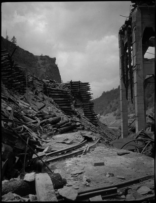 View of damage and stacks of materials after a fire in Burke, Idaho.