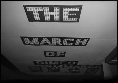 Text for a March of Dimes display in block letters.