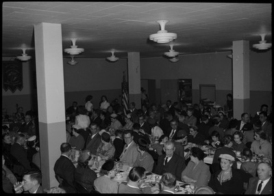 People sitting and eating at tables during a Knights of Columbus Jubilee event.