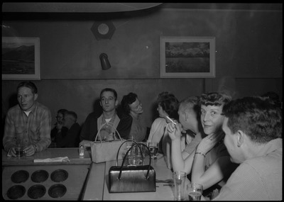 Scene during the Albie's March of Dimes event. People are sitting at the bar counter.