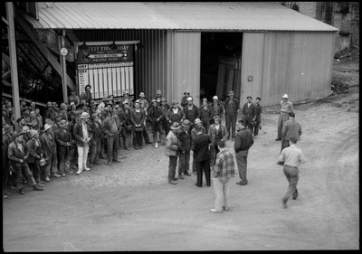 Group photograph of the workers at the Galena plant receiving the Galena Safety Award. They are standing in front of a safety board.