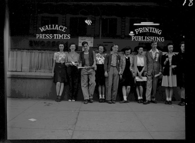 Teenagers standing in front of the Wallace Press-Times during Boys and Girls Week.