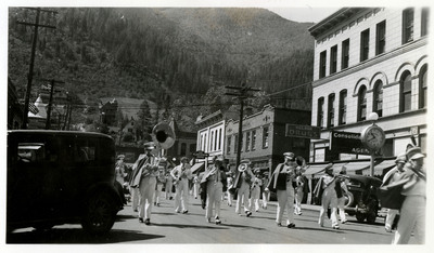 A group of marchers pass by as part of the Memorial Day parade.