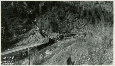 Debris from a landslide covers a road near Wallace.