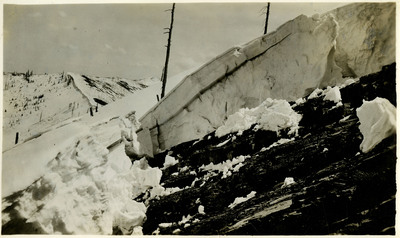 The results of a rock slide above Jack Waite mine's mill. Snow is piled high nearby.
