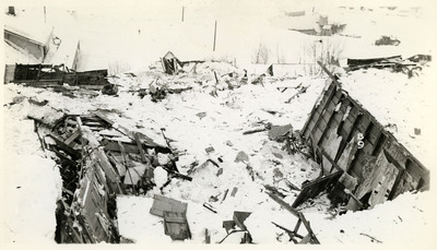 Debris litters the ground after the snowslide in Burke. Much of it appears to be from destroyed buildings.