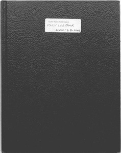 A notebook with a label on the front reading "Taylor Ranch Field Station Daily Log Book 6-2001 to 5-2002."