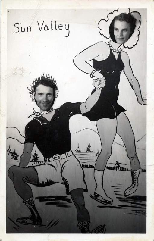 A postcard featuring an  image of two people posing in a photo cutout board. 'Sun Valley' is printed on the cutout. The back of the postcard is blank.
