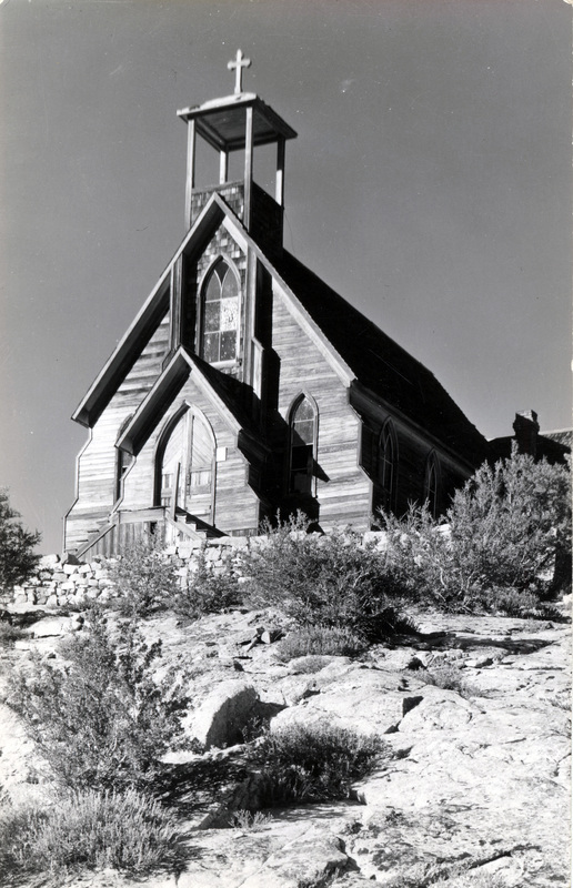A postcard featuring a photo of a church. The back of the postcard is blank, except for a stamp reading "Silver City, Idaho."