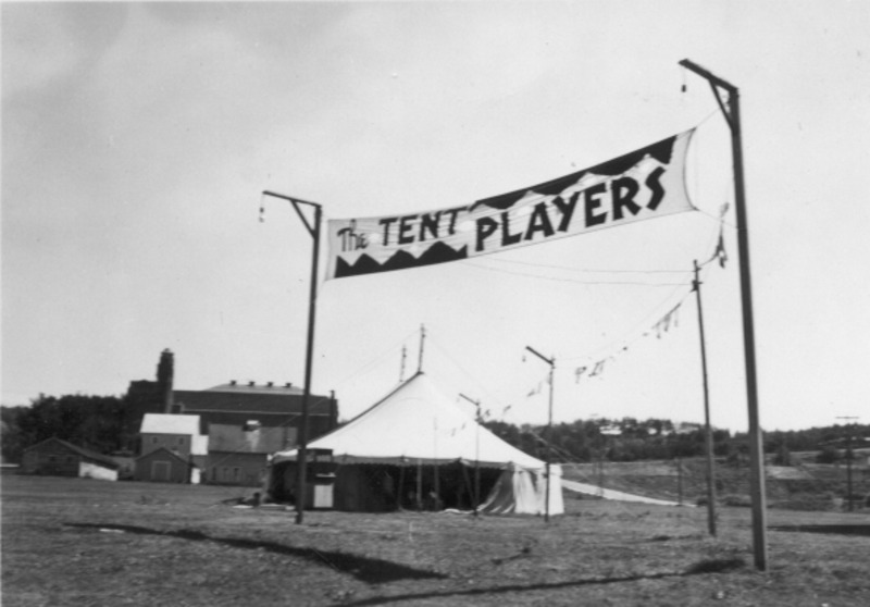 From John Ford Sollers Scrapbook, the Tent Players performed on the lawn close to where the Agricultural Biotech Building now stands. The Memorial Gym can be seen in the background.