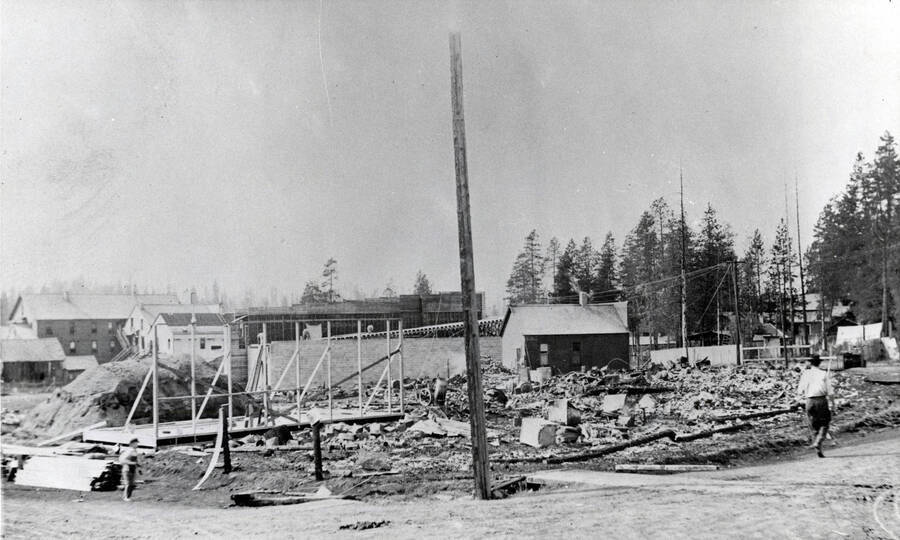 Ruins of the 1914 fire. Surviving are the cobbler shop, right center, the concrete block building below it. The Verdon frame building (in construction) and the old buildings of lower Main Street (left).