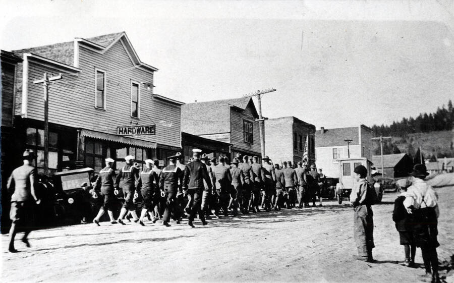 The body of Arnold Asvald, killed in France, was buried in Deary after the war. This contingent of veterans from Deary and Bovill formed the honor guard at the funeral. The officer (rear) is Henry Black. Ensign Gallegher marches ahead of him. Byers Sanderson is in the rear rank, second from the right. Leo Guilfoy also represented Bovill.