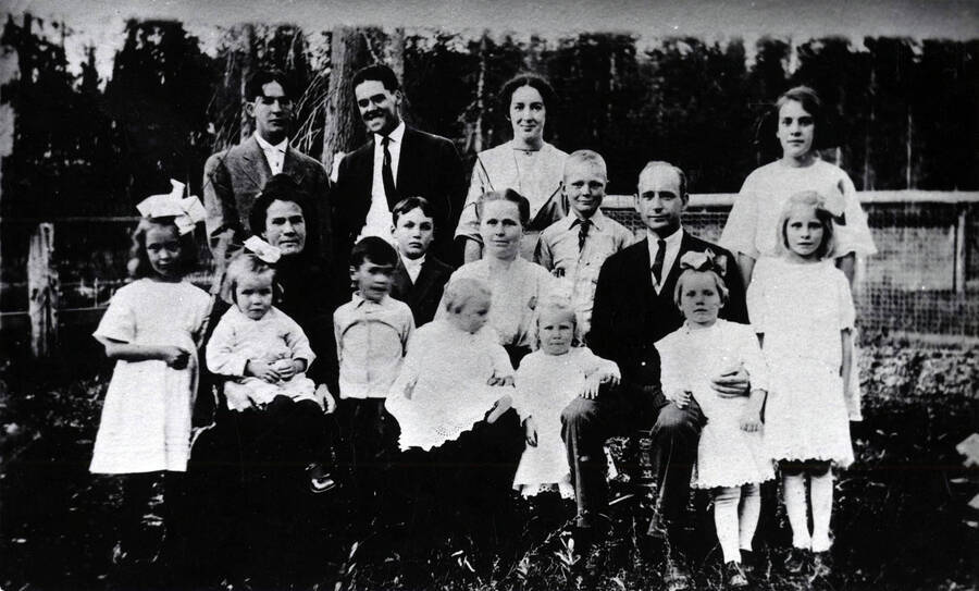 From Trees Grew Tall: 'The A.A. Anderson family. Rear row (left to right): Minnis, Dinnis, and Buelah, and (standing slightly forward) Kyle in front of Dinnis), Clay, and Kate. In front (left to right): Laura, Mrs. Anderson--a sister-in-law--with Sally in her lap, Ellis, Elizabeth with baby Sally in her lap, Elizabeth (daughter), Mr. A.A. Anderson, Mabel, and Christie.'