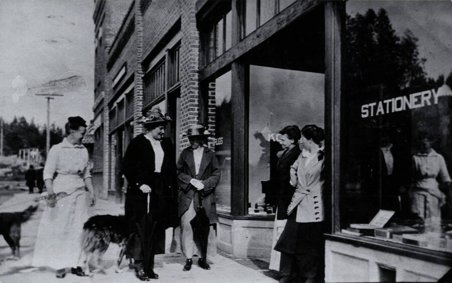 A group of women in front of the Bovill Drug Store. Left to right: Delia Crawford, Sophia Ellison, Mrs. Charles White, Mrs. Carleton Stockwell, Gertrude Hale Witty.