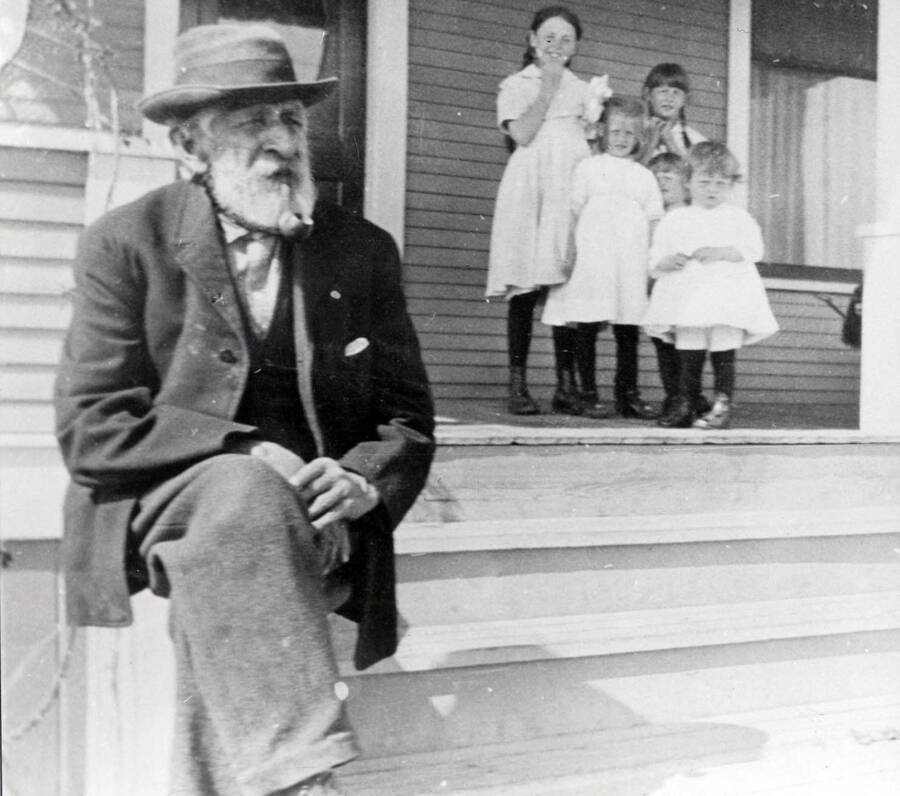 John G. 'Judge' Miller at the Olson home. The Olson girls are in the background.