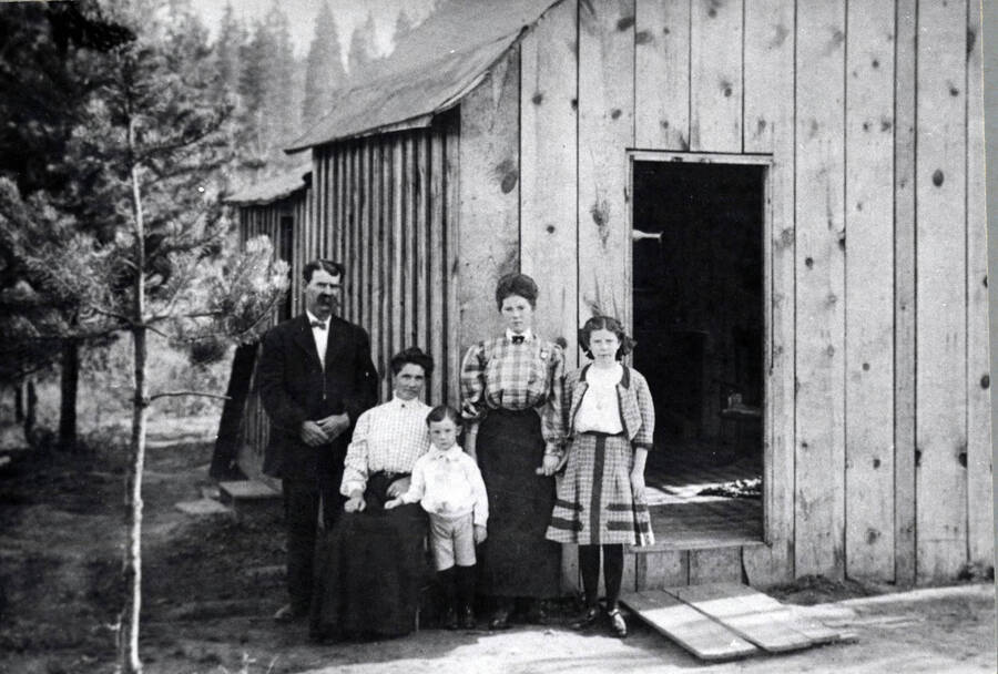 From left to right: W.S. Wood, Mrs. Wood, Almon, Nell, and Edna Wood. The house stood on the south side of Alder Street, near the corner of Third Avenue.
