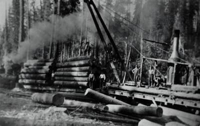 Loading logs by jammer. People in photograph are unidentified.