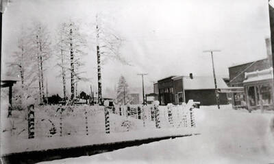 The upper part of Main Street about 1913 or 1914. The Verdon premises are at the right, then the cobbler shop and Groh Store, with the feed storage just beyond. The schoolhouse has only one wing.