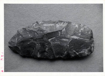 A Native American flint tool, probably a pelt scraper used in tannery.