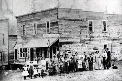 People identified on back. [Miller and Co.'s Cash Store: cash refers to payment option available, opposed to paying on credit.]