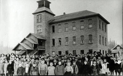 From photo caption in Trees Grew Tall: 'Bovill school in 1913. Of the identities, several are a little uncertain: 3. Olive Pike, 4. Gladys Haverland, 11. Harriet Shattuck, 13. Ralph Kellom, 14. Mrs. Taylor (teacher), 16. Ray Pelton, 17. Mr. Taylor (principle), 26. Clair 'Happy' Hays, 27. Harry Alt, 28. Carlton Stockwell, 37. Delia St. Germain, 44. Adrian Pelton, 48. Kneeland Parker, 49. Clay Anderson, 61. Roberta Tarbox.