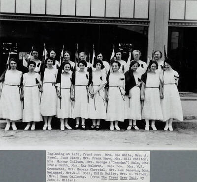 Members are identified in caption: 'Beginning at left, front row: Mrs. Dee White, Mrs. A. Freel, June Clark, Mrs. Frank Hays, Mrs. Bill Chilton, Mrs. Murray Chilton, Mrs. George ('Grandma') Hale, Mrs. Ernie Smith, Mrs. Ray Waldron. Back row: Mrs. W.R. Greenwood, Mrs. George Chrystal, Mrs. Lee Denevan, Mrs. Weingard, Mrs. W.J. Boll, Edith bailey, Mrs. O. Tarbox, (Mrs.) Emma Galloway.'
