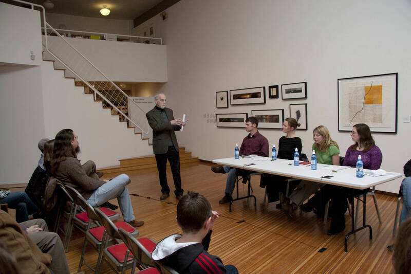 Photograph  1 of Brandon Schrand and MFA Creative Writing Students' Essay Reading 'The Unique and Universal in the Personal Essay: Graduate Student Readings.'  Brandon Schrand is an Assistant Professor of English. Pictured: Rodney Frey introduces MFA students in University of Idaho Prichard Gallery.