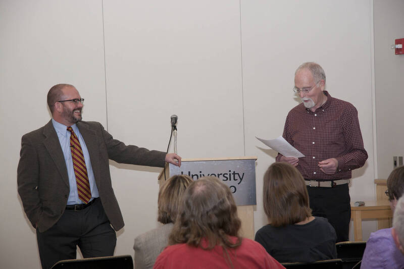 Photograph  2 of Garth Reese's Colloquium Talk 'Invisible Spokes: The Ubiquity of Magic in the West.'  Garth Reese is an Associate Professor and Head  of the Library's Special Collections and Archives. His research focus is Religious Studies. Pictured: Rodney Frey introduces Reese.