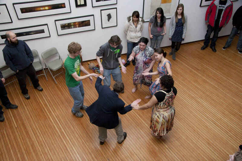 Photograph  25 of Barry Bilderback's Workshop and Performance 'Akwaaba and the Organization of Traditional Music and Dance in Ghanaian Culture.' Barry Bilderback is Assistant Professor of Music. Navin Chettri and World Beat were partners for the performance. Pictured: Barry Bilderback and audience participants at UI Prichard Gallery.