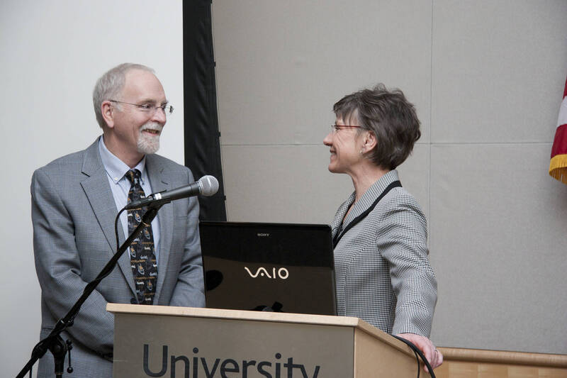 Photograph  1 of Nancy Chaney's Colloquium Talk 'Adventures of time and space travel aboard an amazing machine: The wheel as political metaphor..' Nancy Chaney is an alumnus of University of Idaho and Mayor of Moscow. Pictured: Rodney Frey and Nancy Chaney.