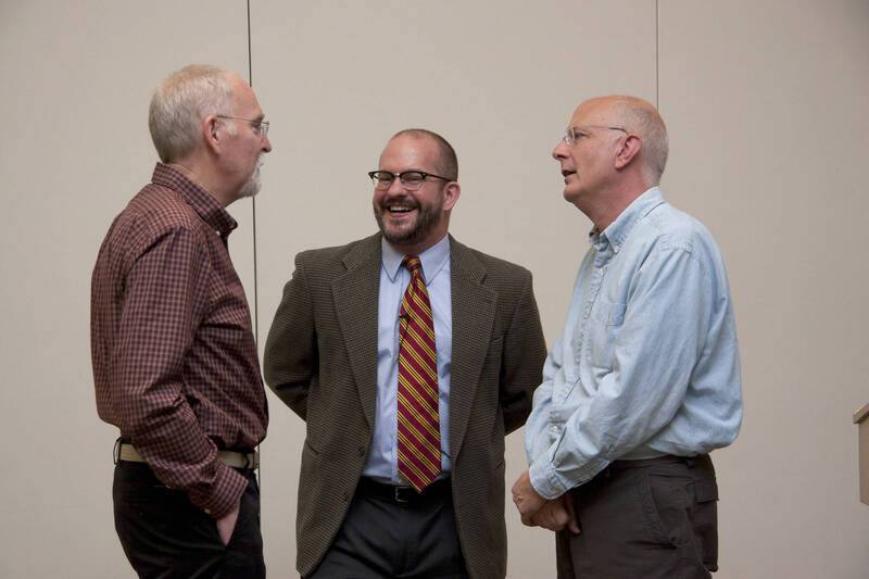Photograph  1 of Garth Reese's Colloquium Talk 'Invisible Spokes: The Ubiquity of Magic in the West.'  Garth Reese is an Associate Professor and Head  of the Library's Special Collections and Archives. His research focus is Religious Studies. Pictured L to R: Rodney Frey, Garth Reese, Dan Bukvich.