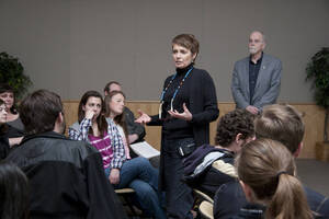 Photograph  14 of Janis Johnson's Colloquium Talk 'This Is the Sound of Survivance: Nez Perce Indians Playing Jazz.' Janis Johnson is Assistant Professor English. Pictured: Janis Johnson talks with audience.