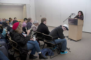 Photograph  9 of Carmen Suarez's Colloquium Talk 'Un Testimonio:  Quien Soy Yo?  Who Am I? - A Chicago-born Latina's Path to Ethnic Identity and Activism.' Carmen Suarez is Director, Office of Human Rights, Access and Inclusion. Pictured: Audience members poses question to Carmen Suarez.